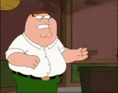 peter griffin from family guy is making a funny face while standing in front of a table .