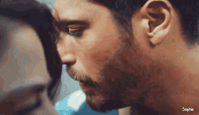 a close up of a man 's face with the name sophie visible