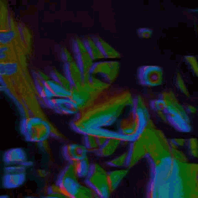 a close up of a person 's face with a green eye
