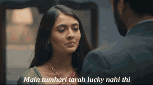 a man and a woman are looking at each other with the words main tumhari tarah lucky nahi thi written below them