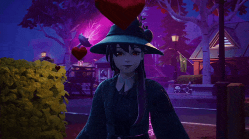 a woman wearing a witch hat and gloves is standing in a park at night