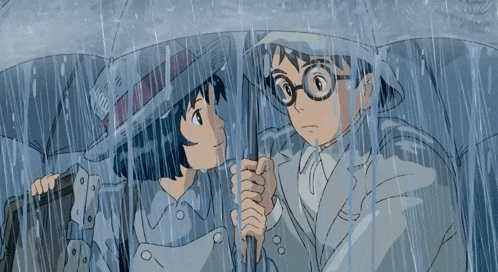 a man and a woman are holding umbrellas in the rain