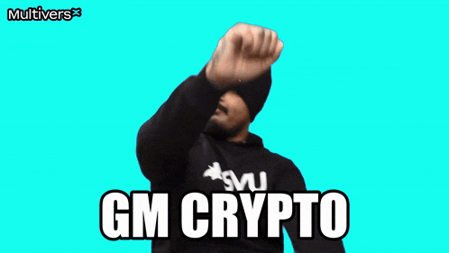 a man wearing a beanie and a sweatshirt that says gm crypto on it