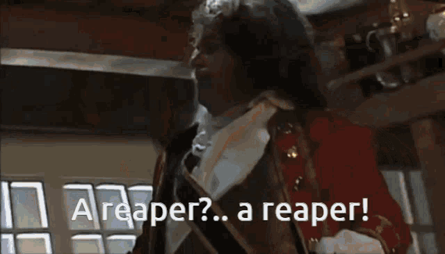 a man in a suit says a reaper
