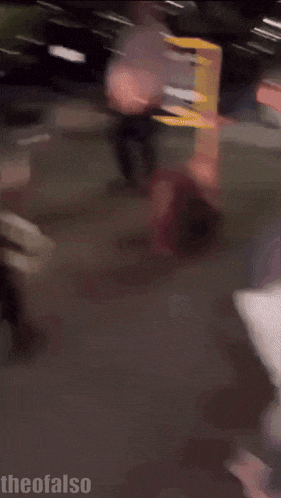 a blurred image of a man being attacked by a police officer with the words " theofalse " at the bottom