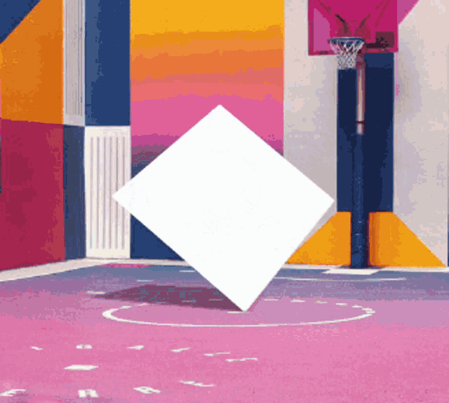 a colorful basketball court with a hoop and a white square in the middle