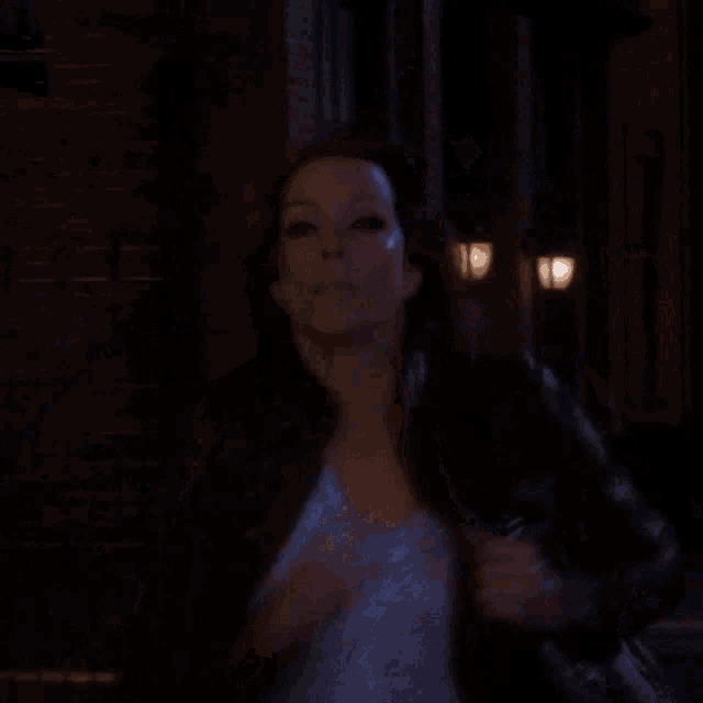 a blurry picture of a woman walking down the street