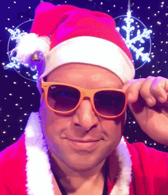 a man wearing a santa hat and sunglasses