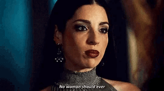 a woman is talking to another woman in a dark room and says no woman should ever .