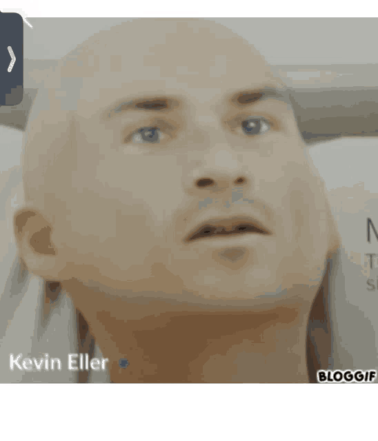 a bald man is laying in a hospital bed and the name kevin eller is on the bottom