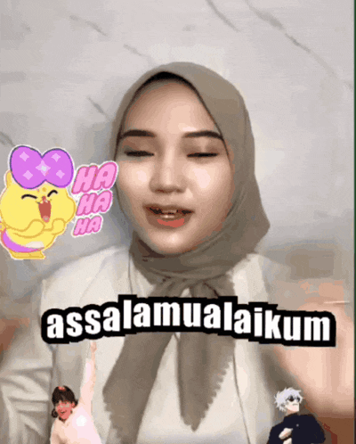 a woman wearing a hijab says " assalamualaikum " in front of a yellow cat