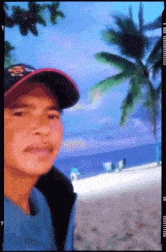 a pixelated image of a man wearing a hat that says dickies