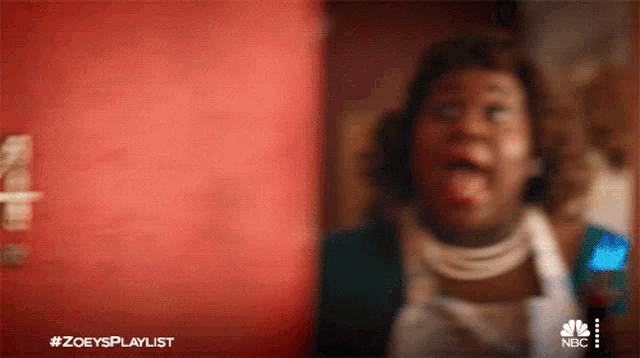 a blurred image of a woman with the hashtag #zoeysplaylist on the bottom right