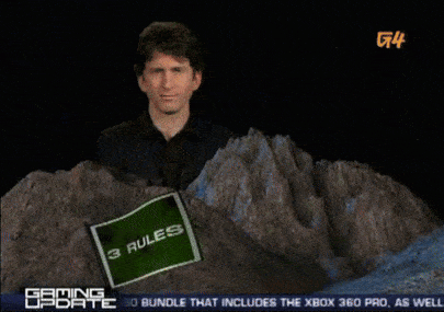 a man holding a sign that says rules in front of a mountain