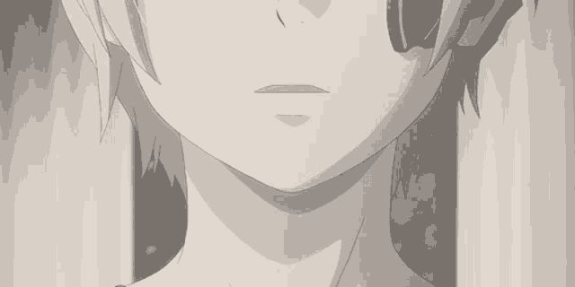 it is a black and white photo of a person 's face .