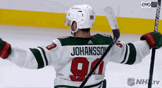 a hockey player wearing a jersey with the number 91 on it