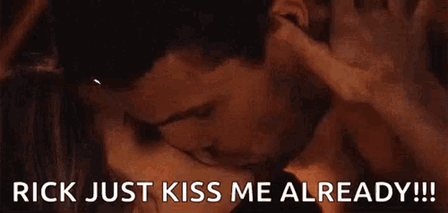 a man and a woman are kissing with the words `` rick just kiss me already !! ''
