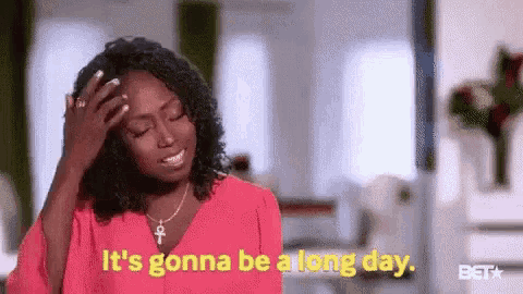 a woman in a pink shirt is holding her hand to her forehead and saying `` it 's gonna be a long day ''