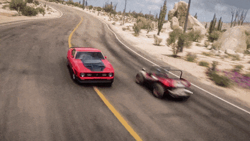 a red car and a red buggy are driving down a road