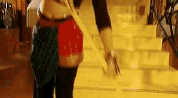 a woman standing on a set of stairs with a purse
