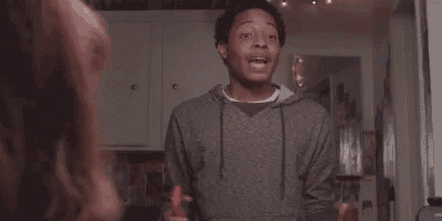 a man is talking to a woman in a kitchen and saying `` i have a dollar in my bank account '' .