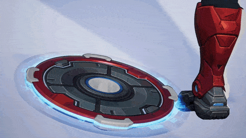 a person 's foot is standing on a circular object with a blue light around it
