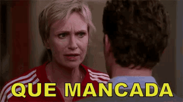 a man and a woman are looking at each other and the words que mancada are visible