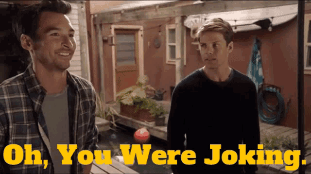 two men are standing on a porch with the words oh you were joking behind them