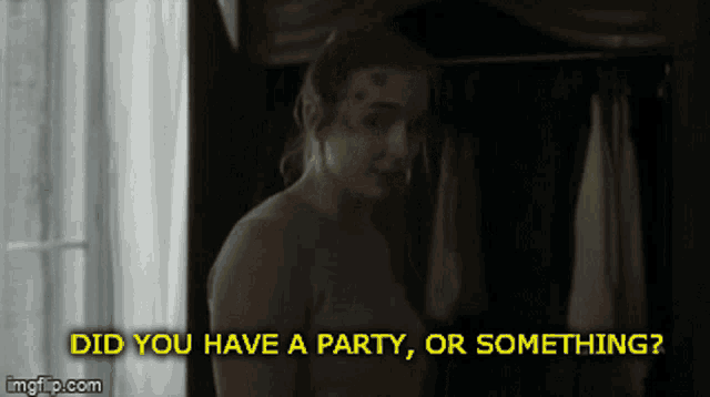 a woman is standing in a dark room with the words did you have a party or something below her