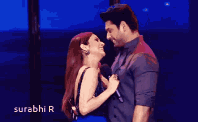 a man and a woman are looking into each other 's eyes and the words surabhi r are on the bottom