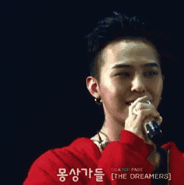 a man singing into a microphone with the words " i love you " on the bottom