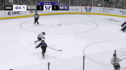 a hockey game is being played and the score is 1 to 1