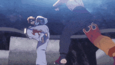 a man in a white shirt is kicking another man in orange pants with the letter o on them