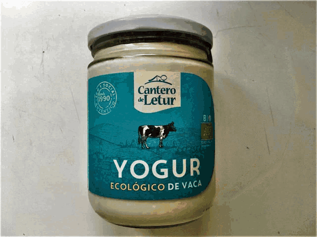 a jar of cantero de letur yogurt with a cow on it