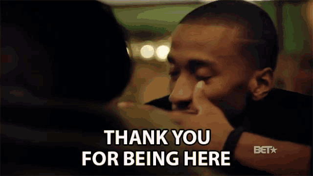 a man says thank you for being here in front of another man