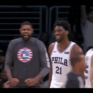 a philadelphia basketball player wearing a jersey with the number 21 on it
