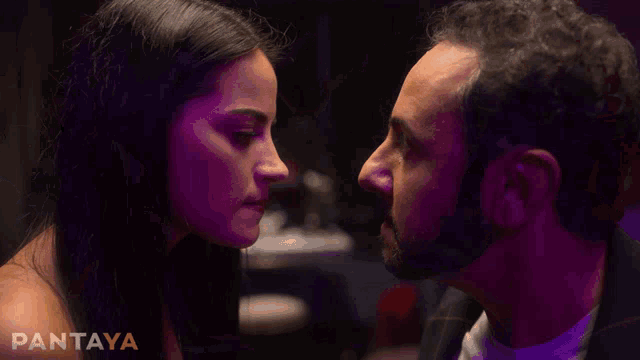 a man and a woman kissing with the word pantaya in the background
