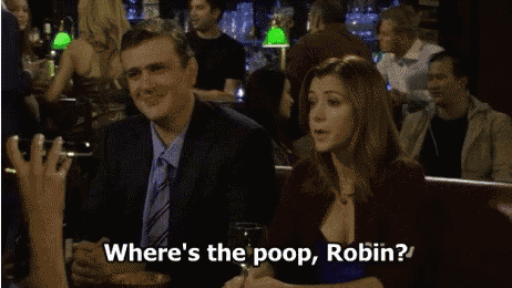 a man and a woman are sitting at a table and the woman is asking where 's the poop robin '
