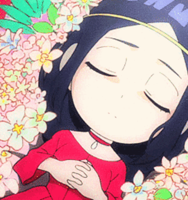 a girl in a red dress is sleeping with her eyes closed in front of flowers