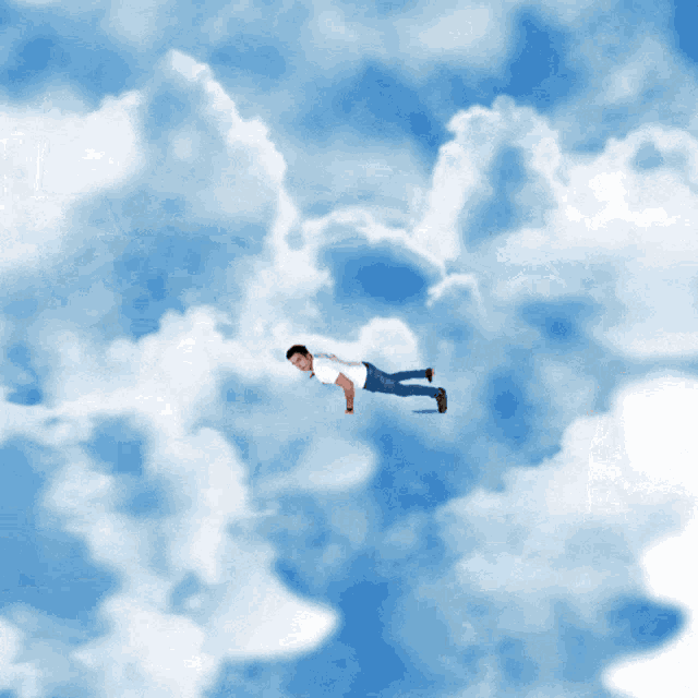a man in a white shirt is flying through a cloudy sky