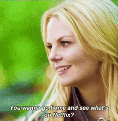 a woman is smiling and talking about netflix