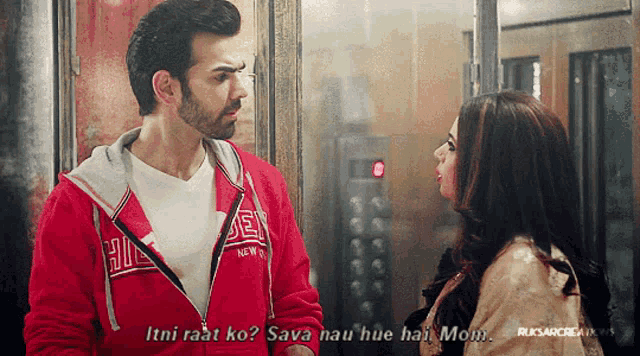 a man in a red jacket that says ' hi ' on it