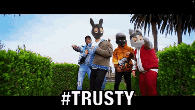 a group of people wearing bunny masks are standing next to each other with the words #trusty in the corner