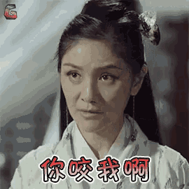 a woman with chinese writing on her face is wearing a white kimono .