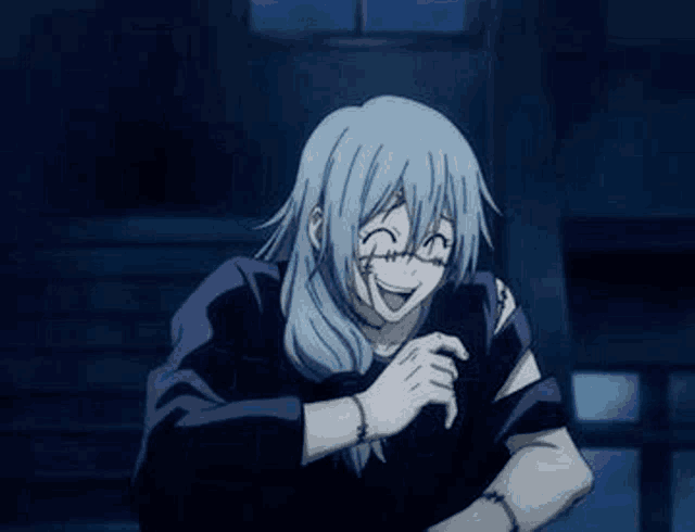a person with blue hair and stitches on their face is laughing .
