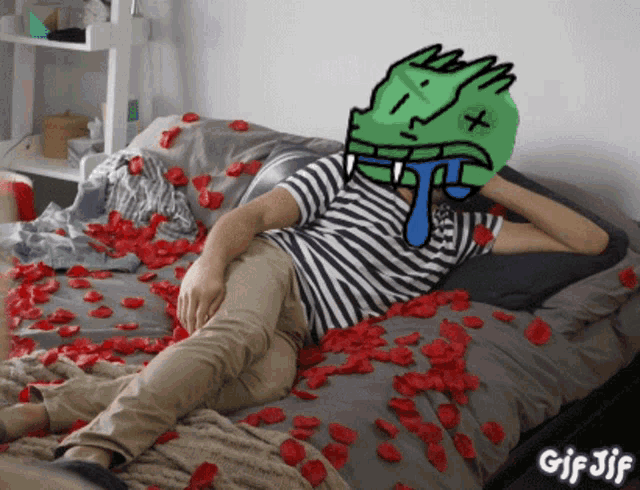 a gif of a person laying on a bed with rose petals around them