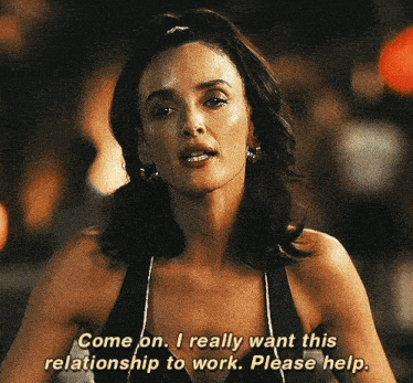 a woman in a black tank top says come on i really want this relationship to work please help