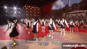 a group of girls are dancing on a stage with the words " communist party is good " in the corner