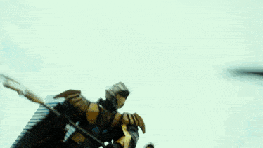 a blurred image of two robots fighting with a white background