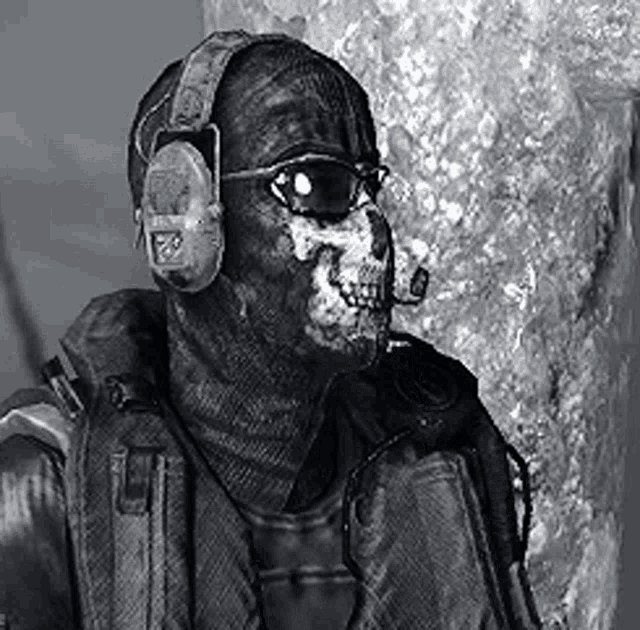 a black and white photo of a soldier with a skull on his face .